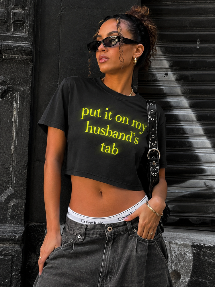 Put It On My Husband’s Tab Crop Tee Shirt (Black)