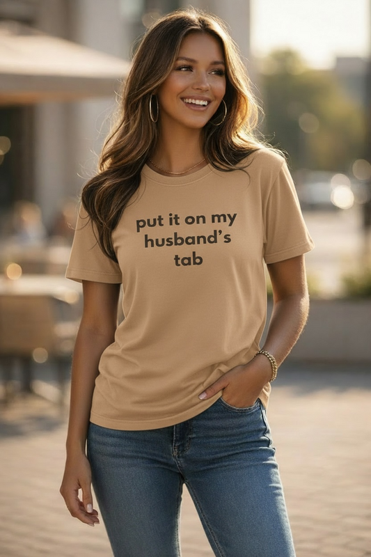 Put It On My Husband’s Tab Tee Shirt-Tan/Brown